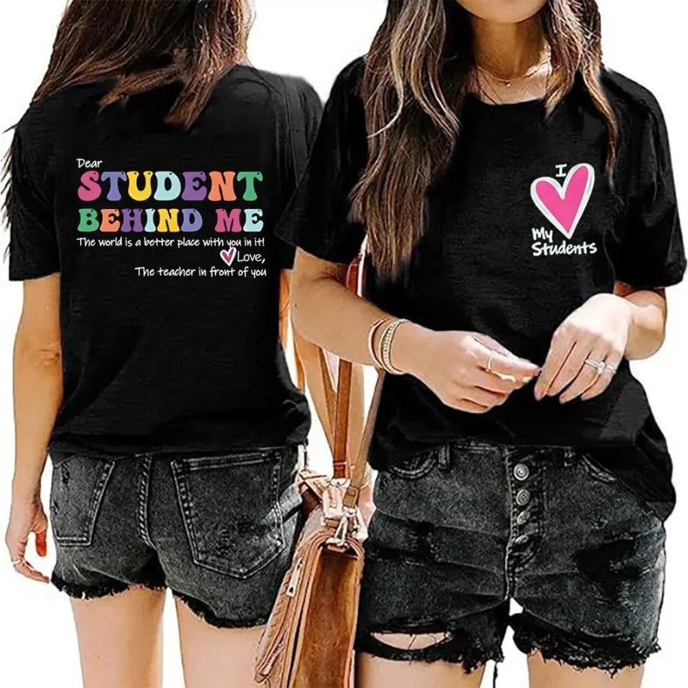 Front and Back View: Spread positivity with the "Dear Student Behind Me, The World Is a Better Place With You In It" T-Shirt from TeachingTeez.com! This inspirational tee is perfect for K-12 educators who want to uplift their students. Made from high-quality fabric, this comfortable black shirt is ideal for any classroom. Show your appreciation and inspire with this cute teacher t-shirt—order yours today at TeachingTeez.com!