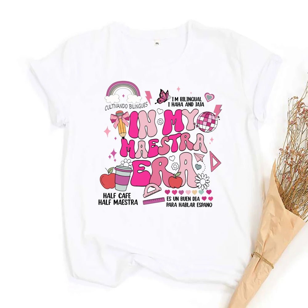 "In My Maestra Era" T-Shirt - TeachingTeez.com. Pink girly version. Featuring a coffee cup, rainbow, disco ball, and a variety of other designs. Shop today at teachingteez.com!